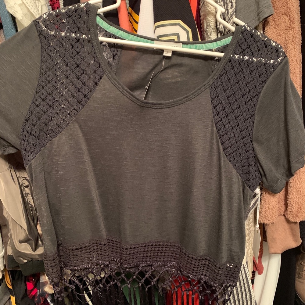 Grey blouse with weaving and tassels